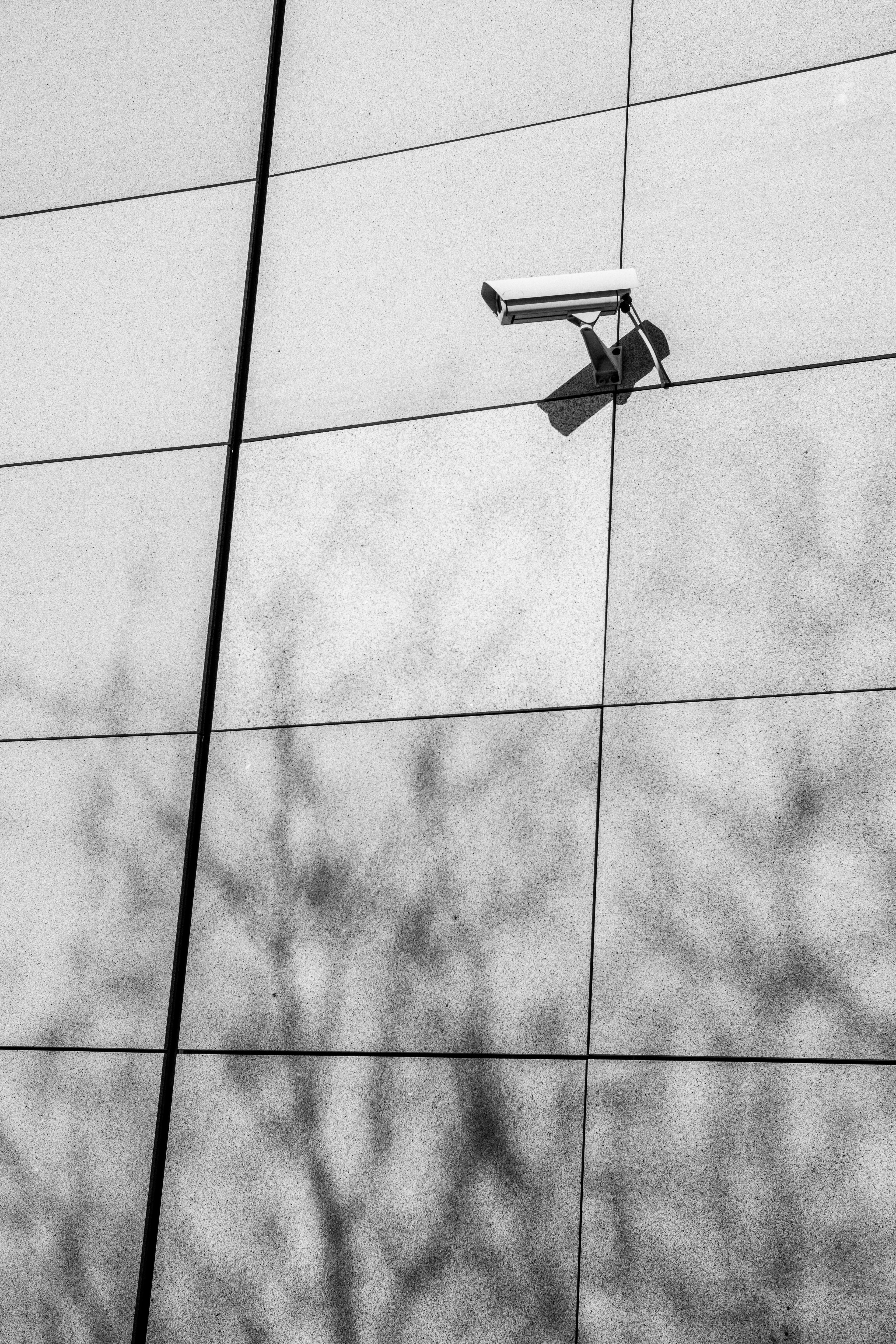 Mounted outdoor security camera on a modern building wall